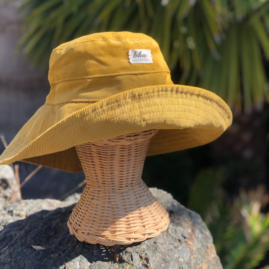Mustard yellow wide brim sun hat made with corduroy.
